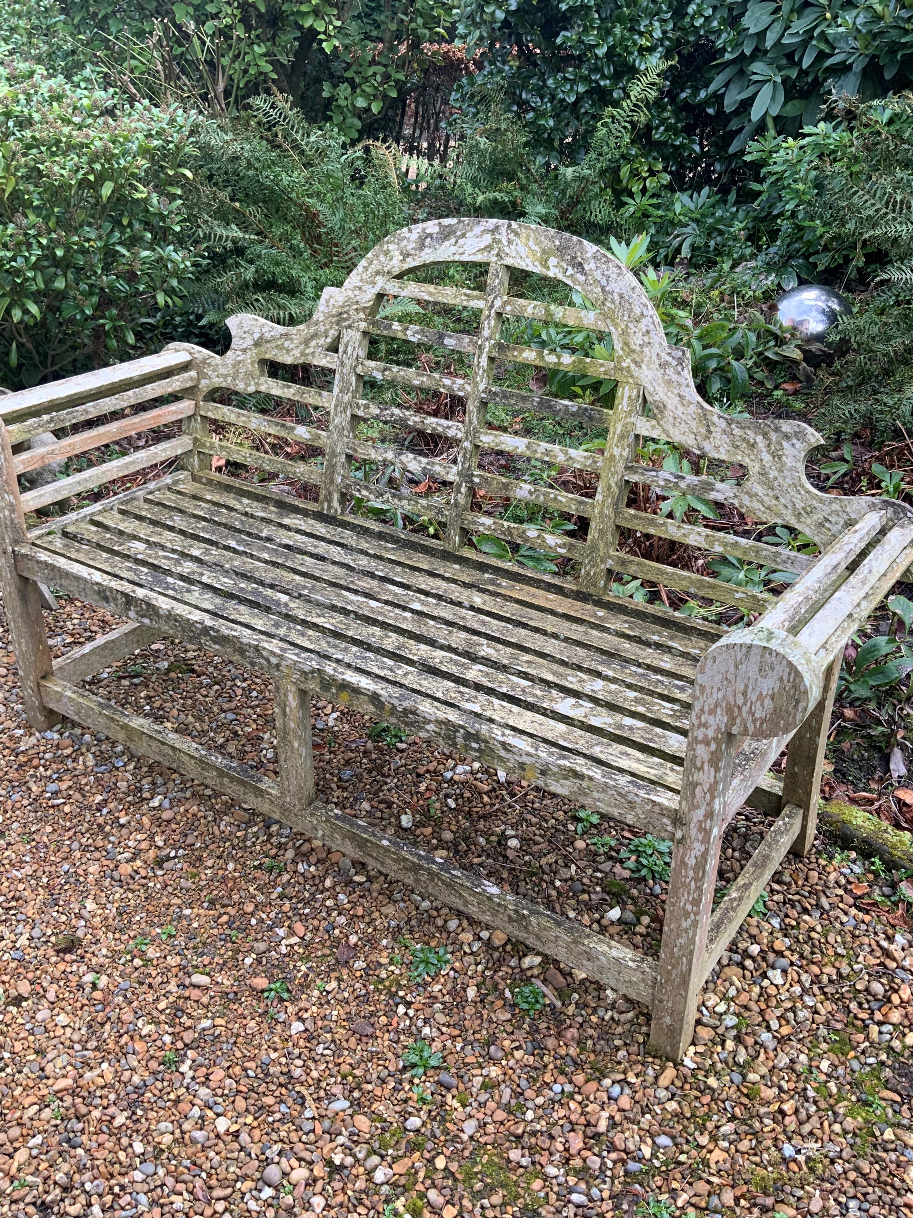 A pair of Lutyens design weathered teak garden benches, length 167cm, depth 58cm, height 104cm